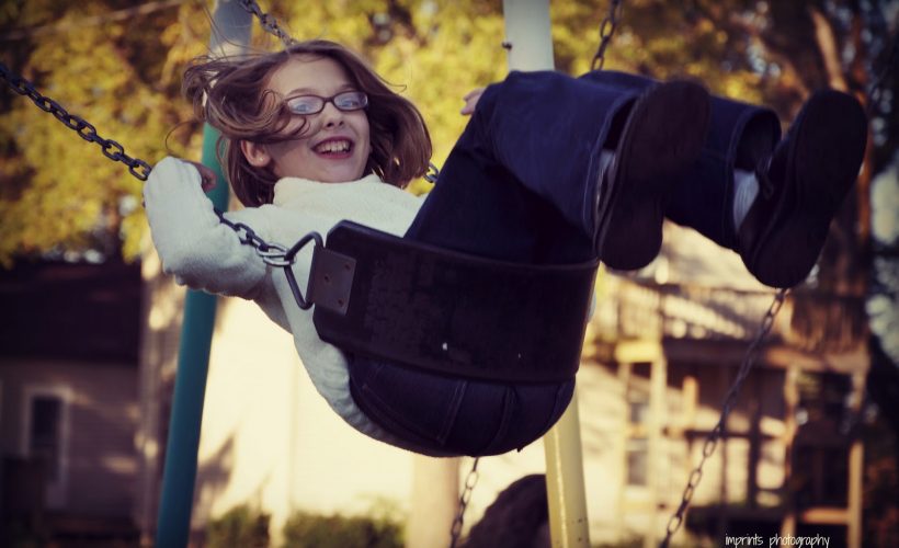 Girl on swing in fall by Katie M. Reid Photogprahy