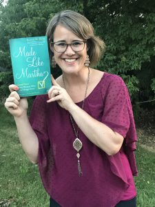 Author Katie M. Reid holding her book Made Like Martha