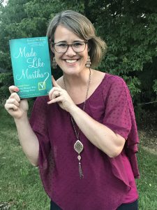 Author Katie M. Reid holding her book Made Like Martha 