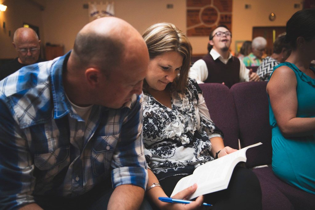 Mike and Lee Nienhuis praying Charis Seed Photography